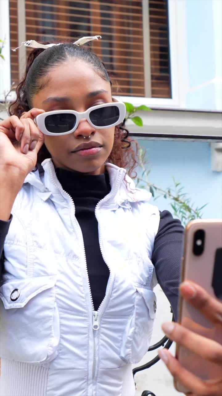 Young Woman Taking a Selfie with Sunglasses