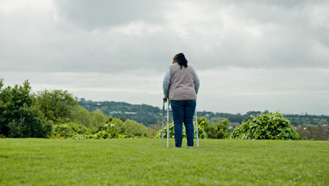 Walking-frame,-garden-and-elderly-woman-in-nature