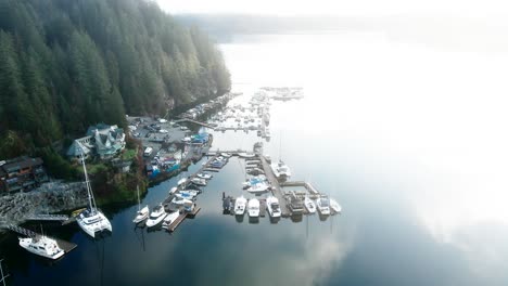 Aerial-pan-falling-shot-of-Deep-Cove-Marina-in-the-Fog-in-North-Vancouver