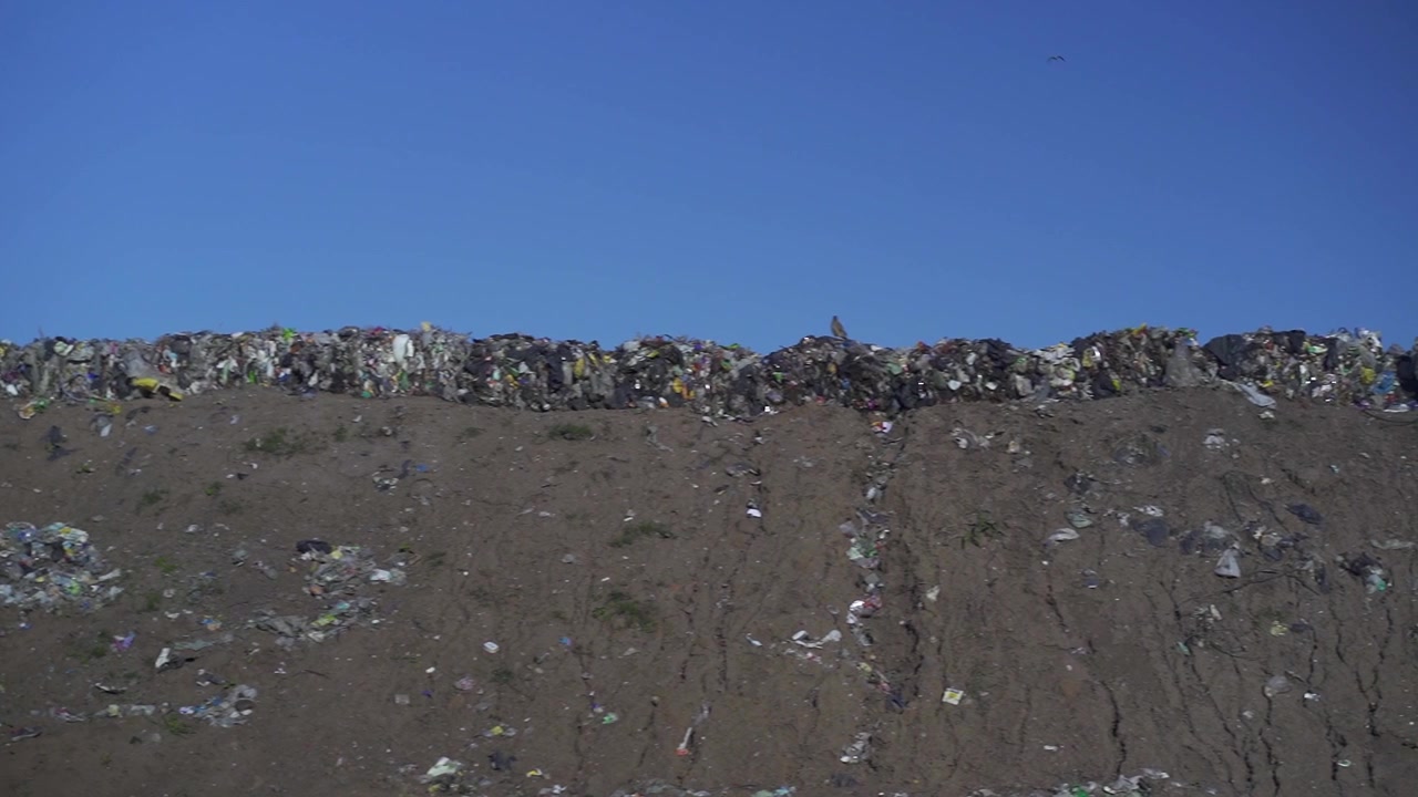 Pan left to right of a waste dumping ground.