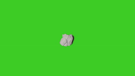 stop motion sequence of sheet of paper being folded and unfolded on top of green screen background 1