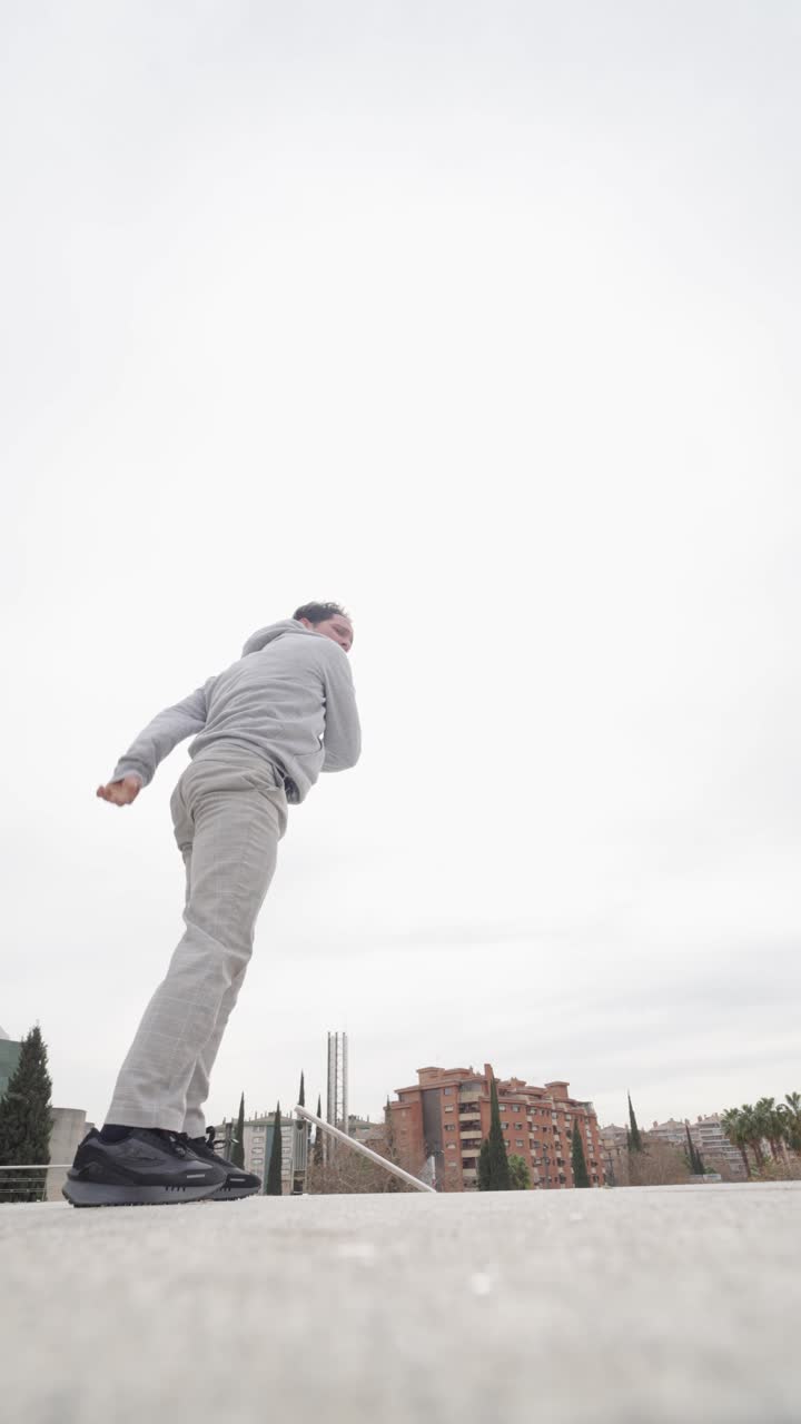 Breakdancer performing a freeze in urban environment