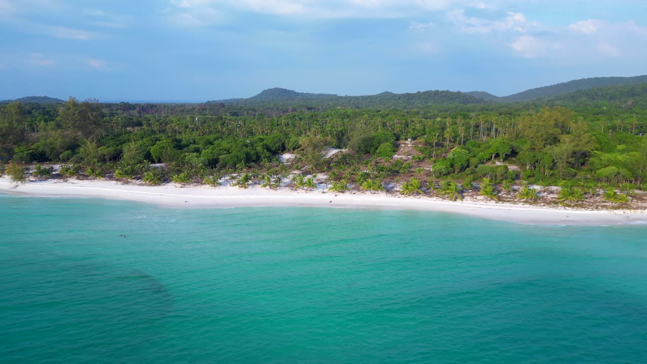 Santa claus is enjoying summer holidays on a beautiful tropical beach. Spectacular aerial view flight pull in drone