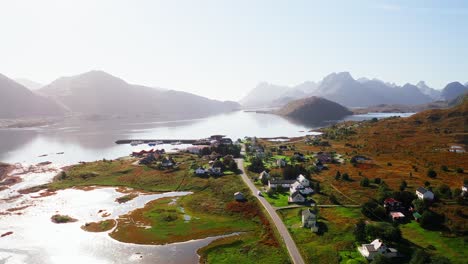 aerial view of a white campervan arriving at fredvang on a blue clear sky day, to do the kvalvika hike, lofoten islands, norway