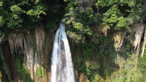 A-nice-close-up-drone-shot-of-Thi-Lo-Su-Waterfall,-located-deep-in-the-remote-jungle,-off-the-beaten-track-in-the-backpacker's-paradise-country-of-Thailand-in-the-area-of-Umphang-in-Southeast-Asia