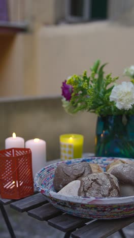 patio dinner with flowers and bread