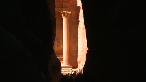 view of the facade of the treasury building in the ancient nabatean ruins of petra jordan through the narrow canyon entrance 3