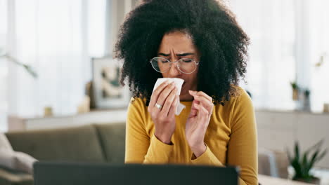 woman suffering from a cold or allergies using a tissue