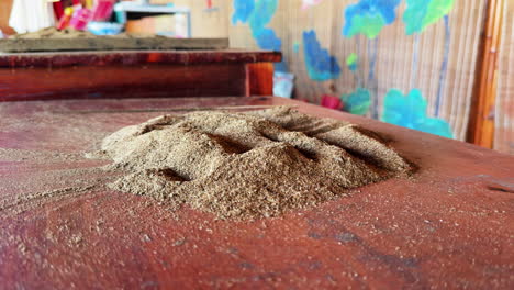 hà nội incense village, close-up of incense powder on wooden surface
