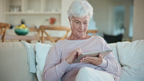 Relax,-tablet-and-senior-woman-on-sofa-in-living