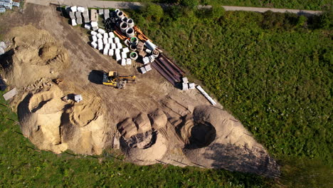 Aerial-of-a-yellow-crane-doing-construction-work-near-Witomino,-Gdynia