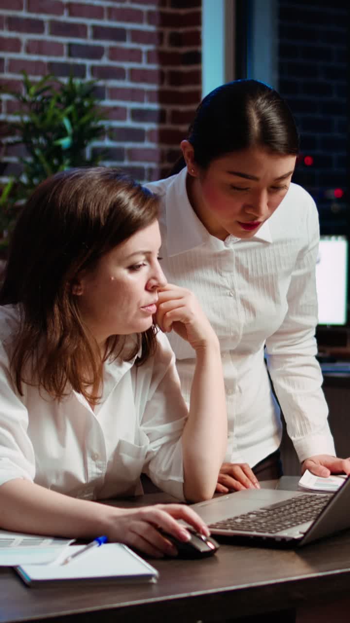 Vertical video Employee asking for help from coworker after being stuck on project task