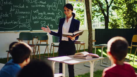 teacher leading a class in an outdoor classroom