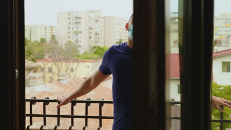 revealing shot of man relaxing on balcony