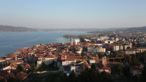 Aerial-view-of-lake-Maggiore-from-Rocca-of-Arona-with-sailboat-and-church