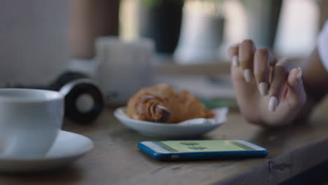 happy african american woman using smartphone in cafe browsing online messages drinking coffee black female texting sharing lifestyle on social media enjoying mobile phone close up