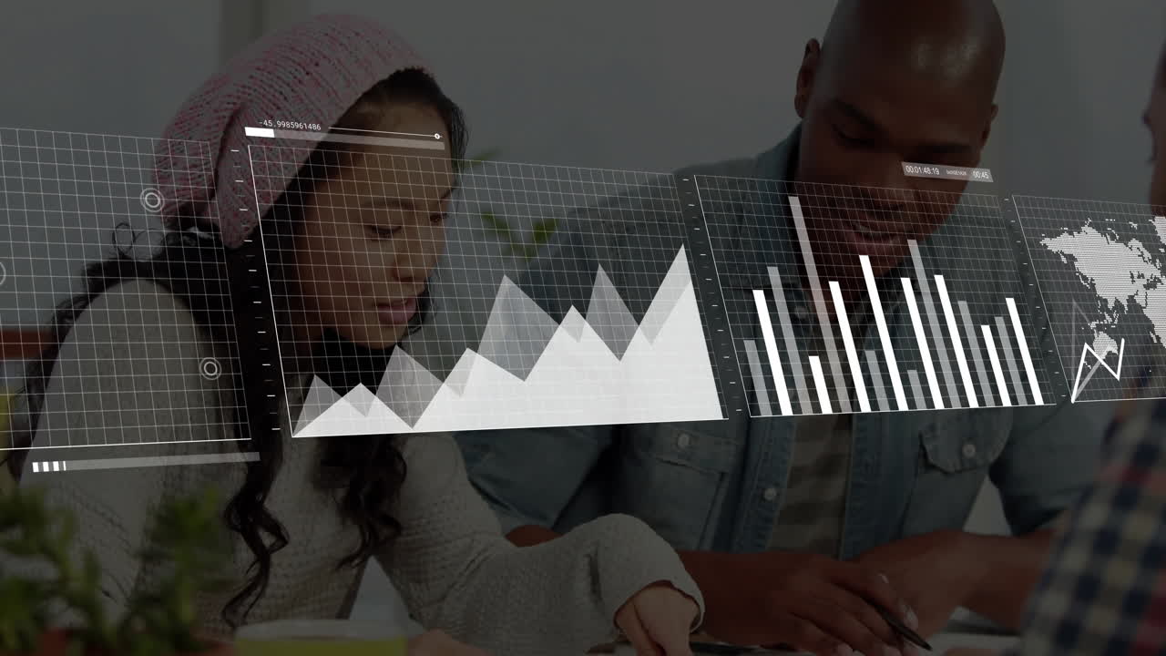 Graph and chart animation over two people collaborating at desk