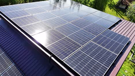 Sunshine glow on solar panels, aerial orbit view