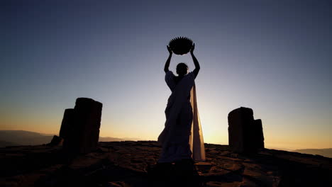 Silhouette of Woman in Ceremony at Sunrise