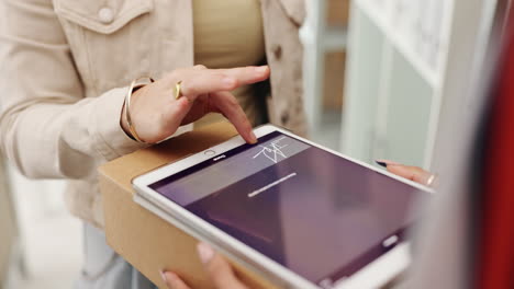 signing for a delivery on a tablet