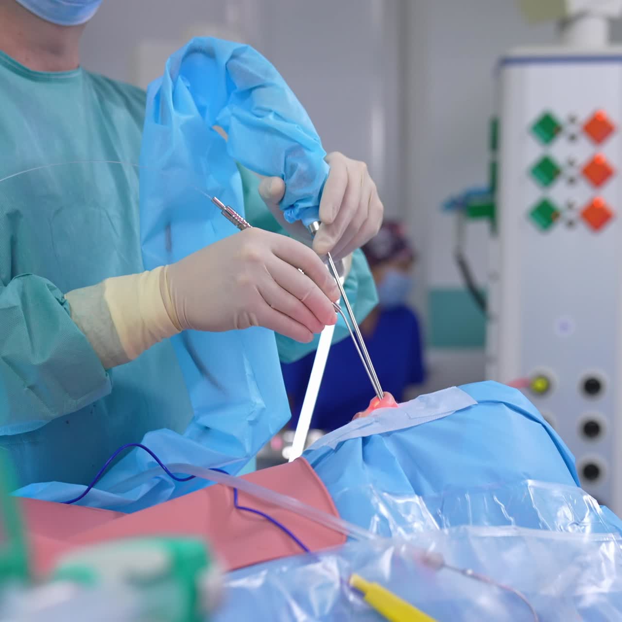 Nasal operation in clinic. Professional surgeon operates patient's nose with special medical instruments in modern clinic. Side view