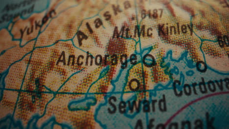 close-up of an alaska map on a globe
