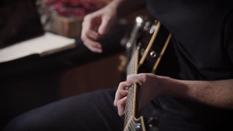 talanted musician is playing on a bass guitar in a professional recornding studio