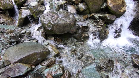 a nice flowing waterfall on the singing pass trail in whistler canada