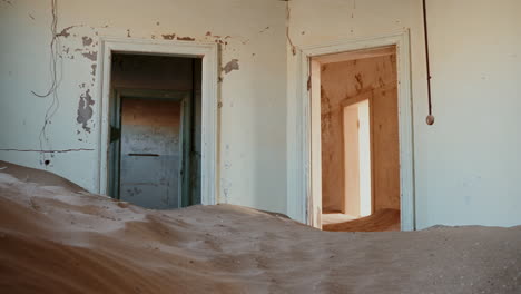 abandoned house buried by sand in the namib desert