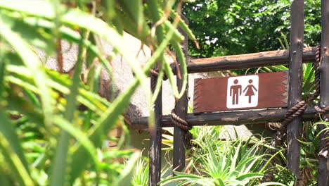 focus pull of a bathroom sign in a nature reserve in slow motion