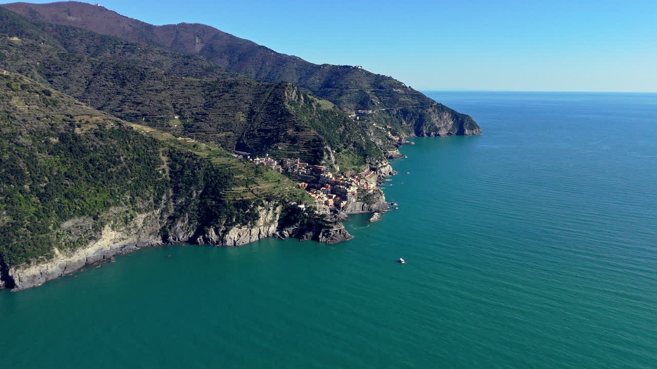 Manarola village by the coast in Cinque Terre, Italy, with a serene sea view