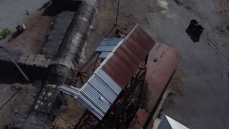 Ancient-mine-tower-and-buildings-of-an-underground-coal-mine-called-Pozo-Julia-in-Fabero-Aerial-view-4