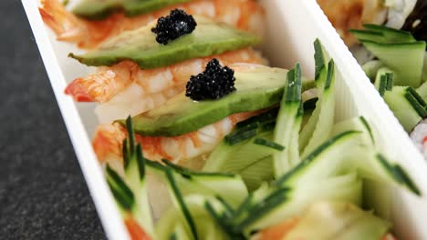 tray of various sushi rolls with shrimp