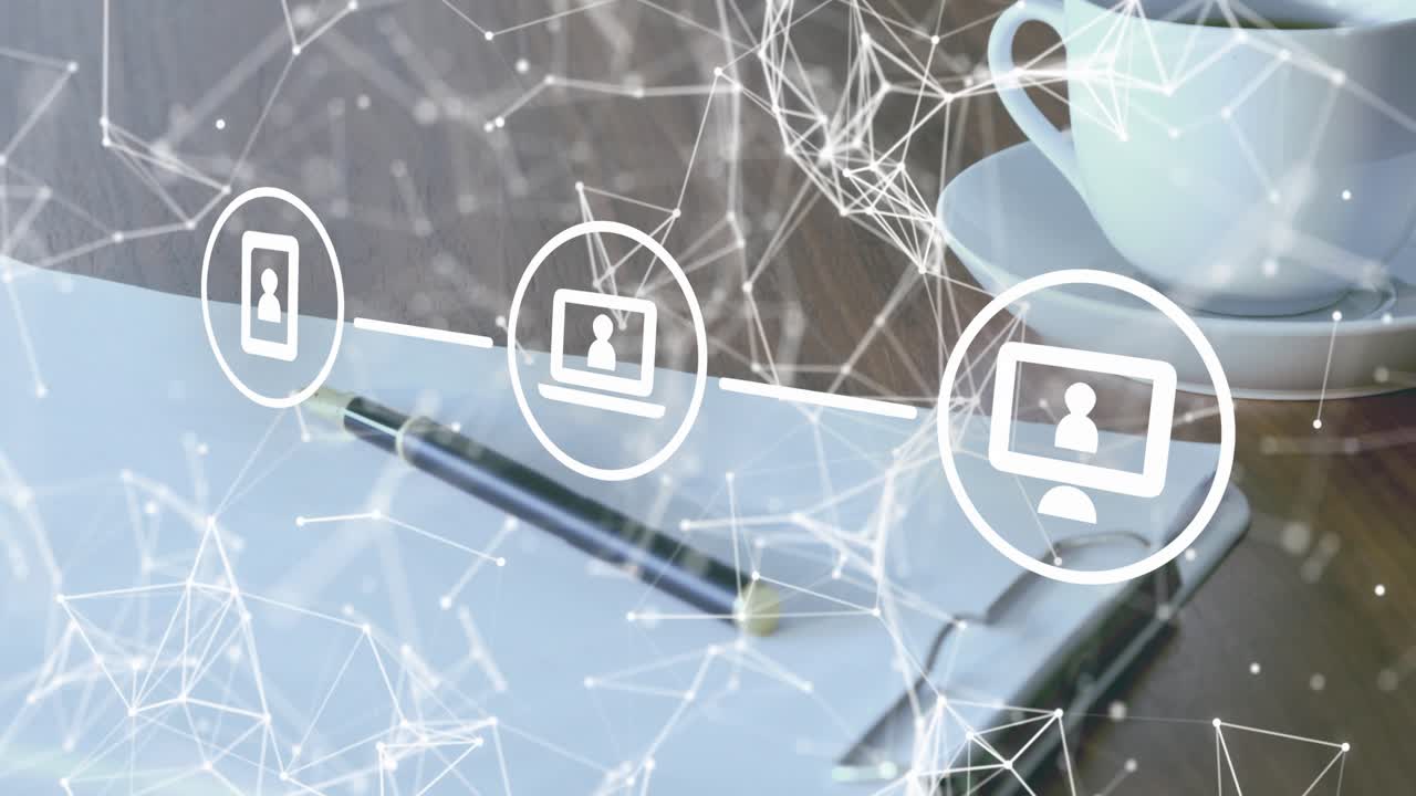 On fade-in network forming smartphone, laptop, PC icons showing connectivity over wooden desk