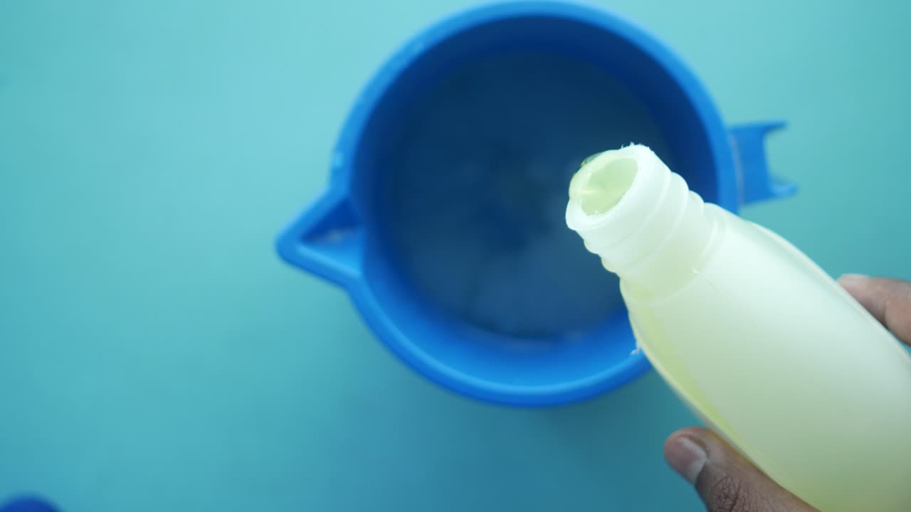Pouring Liquid into a Container