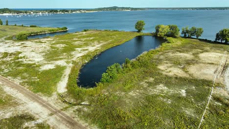 small pond inland off the shore of muskegon lake