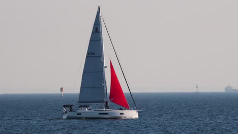 sailboat gliding across calm ocean waters