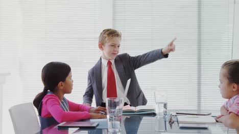 Kids-as-business-executives-having-a-meeting-in-the-board-room-4k