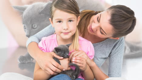 animation of happy caucasian mother and daughter with cat over caucasian girl with cat