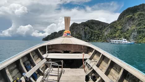 longtail boat ride forward facing and traveling to koh phi phi lee islands in thailand