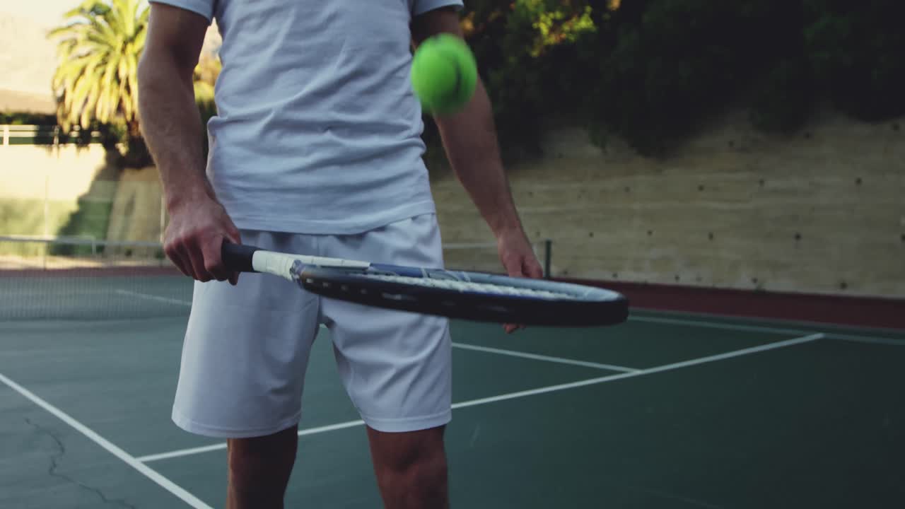 Man playing tennis on a sunny day
