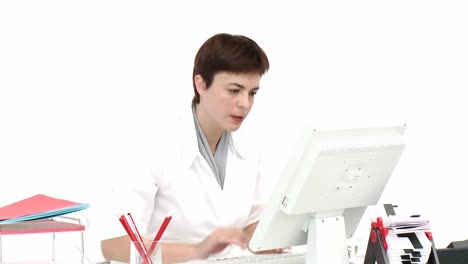 frustrated businesswoman working at a computer