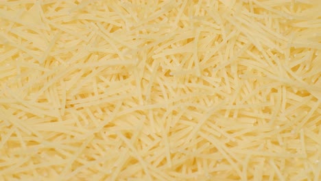 Closeup of Small Noodles Spinning on a Plate Closeup of Small Noodles Spinning on a Plate Video Background with Food Raw Pasta Closeup