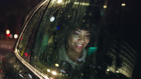 woman using a mobile phone in a car at night