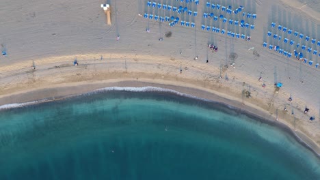 Sandy-beach-waves,-turquoise-blue-water-Las-Vistas-beach-Tenerife,-Costa-Adeje