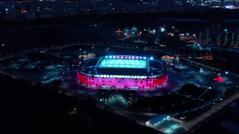 night aerial view of a freeway intersection and football stadium spartak moscow otkritie arena