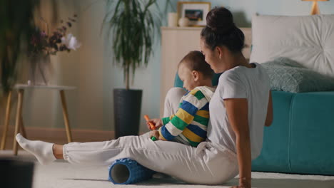 mother and child relaxing and playing together at home