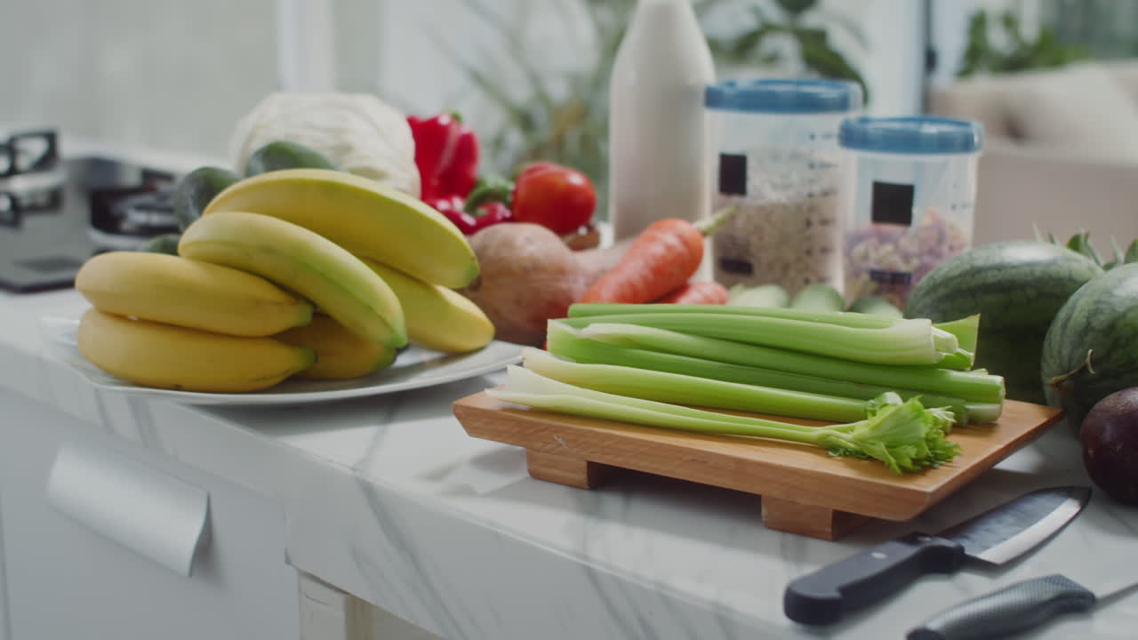 Vegetables and Fruits Prepared for Salad Making on Table