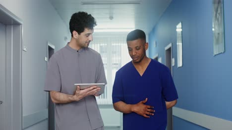 doctors discussing in hospital corridor