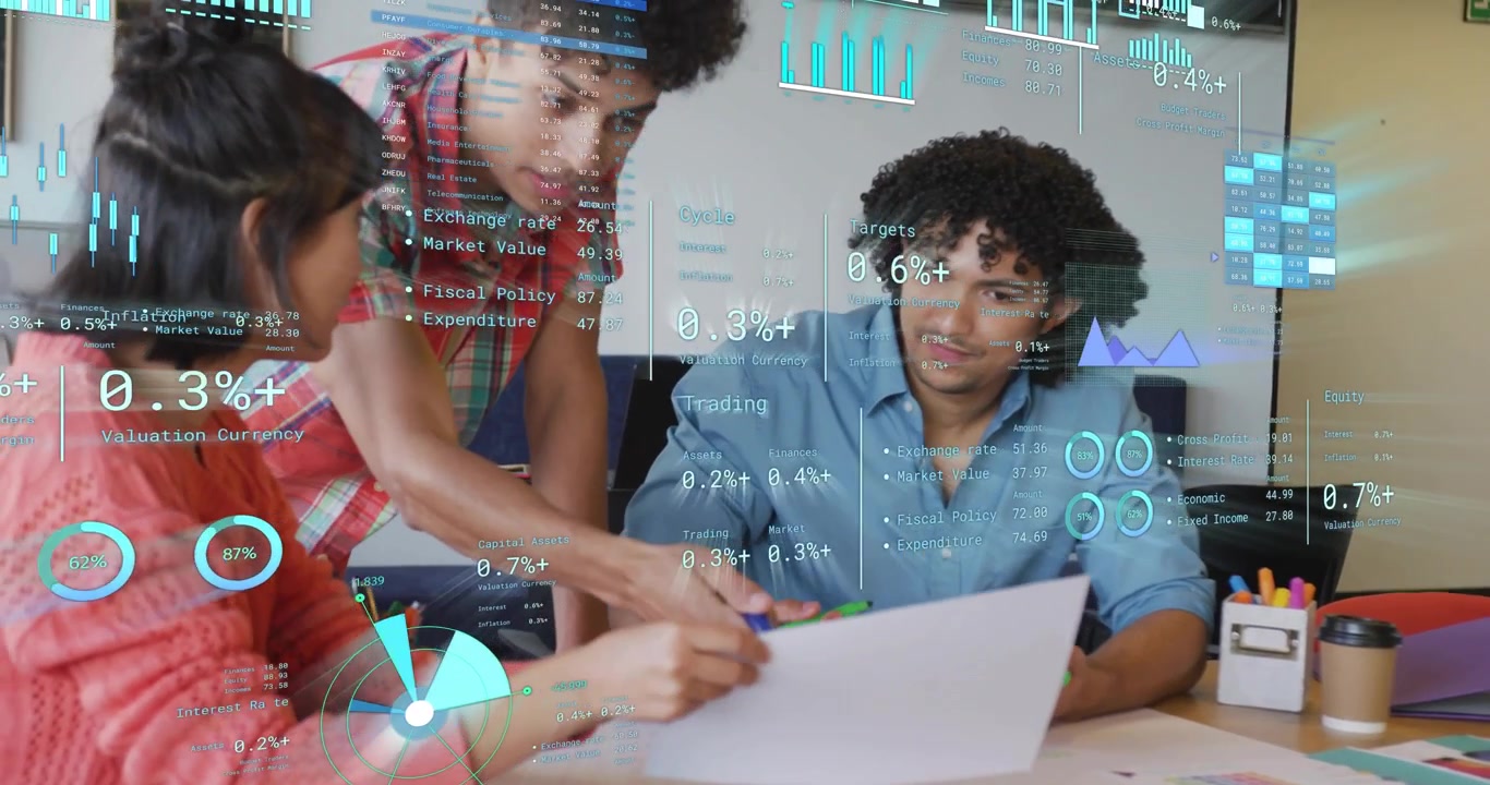 Three colleagues pointing to chart and highlighting figures as animated graphs appear for business
